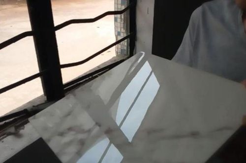 Coated marble slab